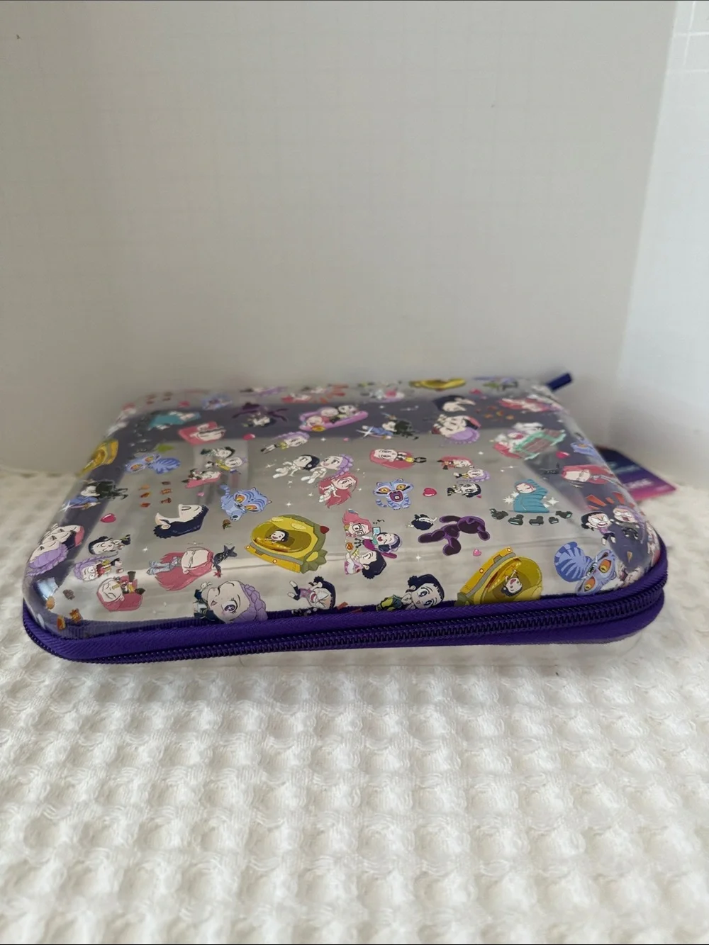 Netflix K-POP Demon Hunters Chibi-Style Clear PVC Pencil Case with Purple Trim.